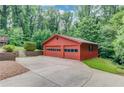 Exterior view of the additional, detached two car garage and extended driveway at 1148 Woodland Cir, Lawrenceville, GA 30043