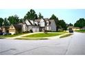 Charming neighborhood home with a spacious lawn and a convenient two-car garage at 50 Worthington Dr, Villa Rica, GA 30180