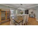 Bright dining room featuring hardwood floors, stylish lighting, and access to the outdoor deck at 202 Heights Pl, Canton, GA 30114