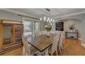 Dining room featuring hardwood floors, decorative lighting, and lots of natural light at 202 Heights Pl, Canton, GA 30114
