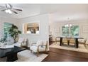 Sun-filled living room flows into the dining area, creating an open and inviting space for entertaining at 2383 Edgewater Sw Dr, Atlanta, GA 30311