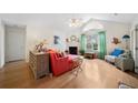 Cozy living room with vaulted ceilings, fireplace, and views of the front yard at 4512 Orchard Trce, Roswell, GA 30076
