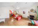 Bright living room with hardwood floors, fireplace, and an open concept design at 4512 Orchard Trce, Roswell, GA 30076