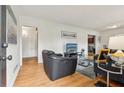Bright living room with hardwood floors, comfortable seating, and stylish decor, creating an inviting atmosphere at 1849 Clay Sw Rd, Mableton, GA 30126