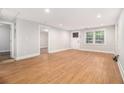 Bright living room features new wood flooring, fresh paint, and natural light at 2803 3Rd Sw Ave, Atlanta, GA 30315