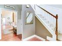 Hallway with staircase and beautiful molding; view to the living and dining area at 4084 Fort Sumter Nw Lndg, Acworth, GA 30101