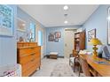 Light blue room featuring a desk, shelving and chest of drawers at 855 Peachtree Ne St # 501, Atlanta, GA 30308