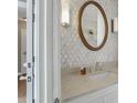 Modern bathroom with decorative tile, a vanity with plenty of counterspace and an attractive mirror at 215 Piedmont Ne Ave # 1406, Atlanta, GA 30308