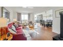 Bright and open living room and dining area with hardwood floors and lots of natural light at 215 Piedmont Ne Ave # 1406, Atlanta, GA 30308