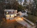 Aerial view of a modern two-story home with a beautifully paved driveway at 1045 Shepherds Ne Ln, Atlanta, GA 30324
