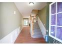Welcoming foyer with hardwood floors, stairs, and view of the living room at 2426 Fairlie Dr, Duluth, GA 30096