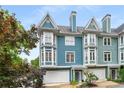 Charming townhome with bay windows, front-entry garages, and colorful, vibrant exterior at 1912 Hosea L Williams Ne Dr # 1, Atlanta, GA 30317