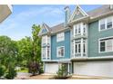 Stylish townhome featuring bay windows, a two-car garage, and inviting curb appeal at 1912 Hosea L Williams Ne Dr # 1, Atlanta, GA 30317