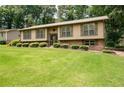 Inviting home with manicured landscaping and a well-maintained lawn at 272 Creek Sw Ct, Marietta, GA 30064