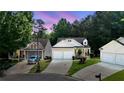 Charming two-story home with a two-car garage and well-maintained landscaping at 428 Redwood Trl, Canton, GA 30114