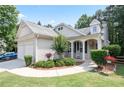 Inviting front porch with a rocking chair and charming curb appeal at 428 Redwood Trl, Canton, GA 30114
