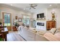 Bright living room boasts fireplace, television, and backyard access at 3508 Cox Cemetery Rd, Social Circle, GA 30025