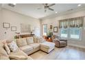 Comfortable living room with neutral colors, hardwood floors, and large windows at 3508 Cox Cemetery Rd, Social Circle, GA 30025