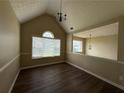 Bright bonus room with wood-look floors, high ceilings, and large window at 132 Peggy Meadows Way, Douglasville, GA 30134