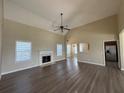 Spacious living room with high ceilings, fireplace, and wood-look floors at 132 Peggy Meadows Way, Douglasville, GA 30134