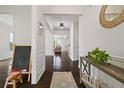 Bright foyer boasts hardwood floors, elegant trim, and views into the living spaces at 1998 Lakeview Bend Way, Buford, GA 30519