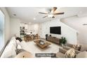 Bright living room features neutral tones, modern furnishings and wood-look floors at 4437 Ben Hill Rd, Atlanta, GA 30349