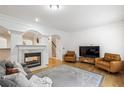 Bright living room with hardwood floors, fireplace, and comfortable seating area at 3901 Old Atlanta Station Se Dr, Atlanta, GA 30339