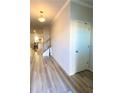 Inviting foyer with light wood floors, leading to the main living area and staircase at 2757 Malton Way, Loganville, GA 30052