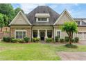 Beautiful home with stone and siding exterior, lush lawn, and well-maintained landscaping at 2855 Middlecreek Way # 2855, Cumming, GA 30041