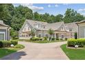 Beautiful neighborhood home featuring a manicured lawn and a two car garage at 2855 Middlecreek Way # 2855, Cumming, GA 30041