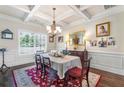 Dining room with hardwood floors, a large window, and stylish decor at 466 Sweet Apple Ln, Buford, GA 30518