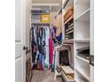 Organized walk-in closet featuring shelving and hanging storage, perfect for maximizing space and keeping belongings tidy at 4854 Cathedral Ct, Powder Springs, GA 30127