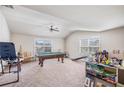 Large game room featuring ample space and natural light, ideal for recreation and entertainment at 4854 Cathedral Ct, Powder Springs, GA 30127