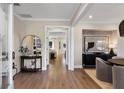 Stunning foyer with hardwood floors, elegant decor, and a view into other rooms of the home at 5430 Hyde Rd, Cumming, GA 30040