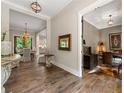 Elegant foyer with hardwood floors leading to dining and office spaces at 131 Forsyth Park Ln, Woodstock, GA 30188