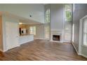 Spacious living room with tall ceilings, fireplace, and lots of natural light at 5920 Hampton Ct, College Park, GA 30349