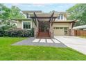 Striking home with stone accents, wood beams, and manicured landscaping, offering curb appeal and modern charm at 1267 Thomas Rd, Decatur, GA 30030