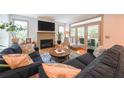 Cozy living room with a fireplace, comfortable seating, and access to an outdoor patio area at 1267 Thomas Rd, Decatur, GA 30030