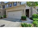 This home has a two car garage and brick facade at 5016 Garrett Ct, Alpharetta, GA 30005
