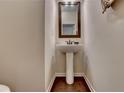 This is a close up of the powder room with hard wood floors at 5016 Garrett Ct, Alpharetta, GA 30005