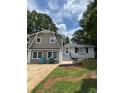 Charming two-story home with neutral siding and modern windows at 1094 Amber Sw Rdg, Lilburn, GA 30047