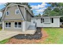 Charming two-story home featuring mixed siding and a well-maintained front yard in a neighborhood setting at 1094 Amber Sw Rdg, Lilburn, GA 30047