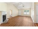 Inviting living room features a fireplace, wood floors, and ample natural light from a large window at 131 Tye St, Stockbridge, GA 30281