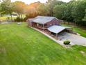 Expansive property with a well-maintained lawn, convenient carport, and charming ranch-style home at 360 Parr Farm Rd, Covington, GA 30016