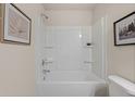 Bright bathroom featuring a shower and tub combination with white fixtures at 52 Leggett Dr # 185, Villa Rica, GA 30180