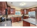 Well-equipped kitchen with stainless steel appliances, granite countertops, and ample cabinet space at 7052 Camp Falls Ct, Winston, GA 30187
