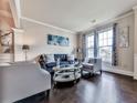 Elegant living room featuring hardwood floors, neutral tones, and stylish furniture arrangement at 423 Livingston Pt, Acworth, GA 30102
