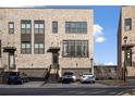 Charming townhome with brick facade, front entry garages, and sleek modern design elements at 3208 Sonnet Se Walk, Atlanta, GA 30339