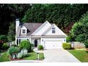 Charming single-Gathering home features a two-car garage, manicured lawn, and traditional architecture at 3954 Rhyne Se Way, Smyrna, GA 30082