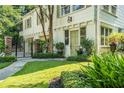 Charming home showcasing a lush green lawn and a beautifully landscaped garden, enhancing the curb appeal at 1821 N Rock Springs Ne Rd, Atlanta, GA 30324